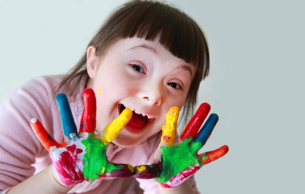 Cute little girl with painted hands